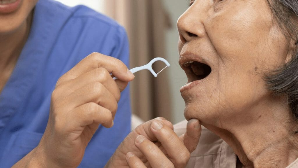 An elder woman at the dentist 