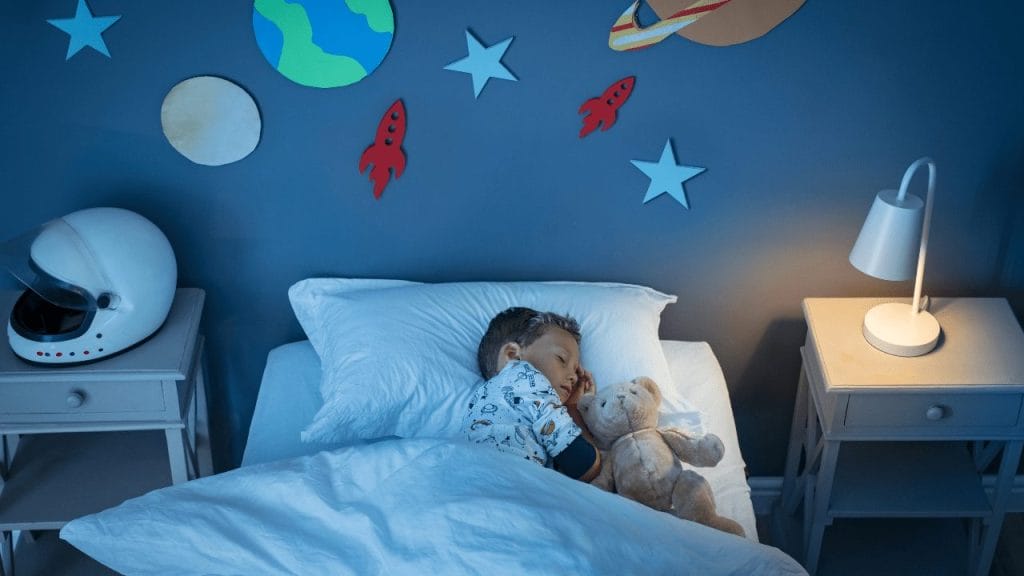 Little boy sleeps with teddy bear