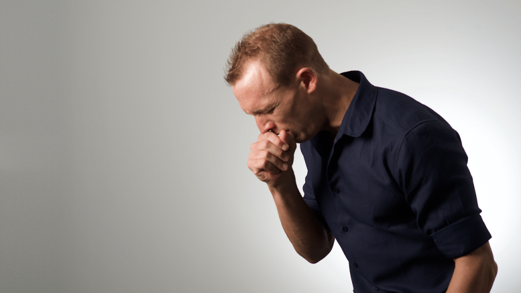 Signs of choking: man coughing